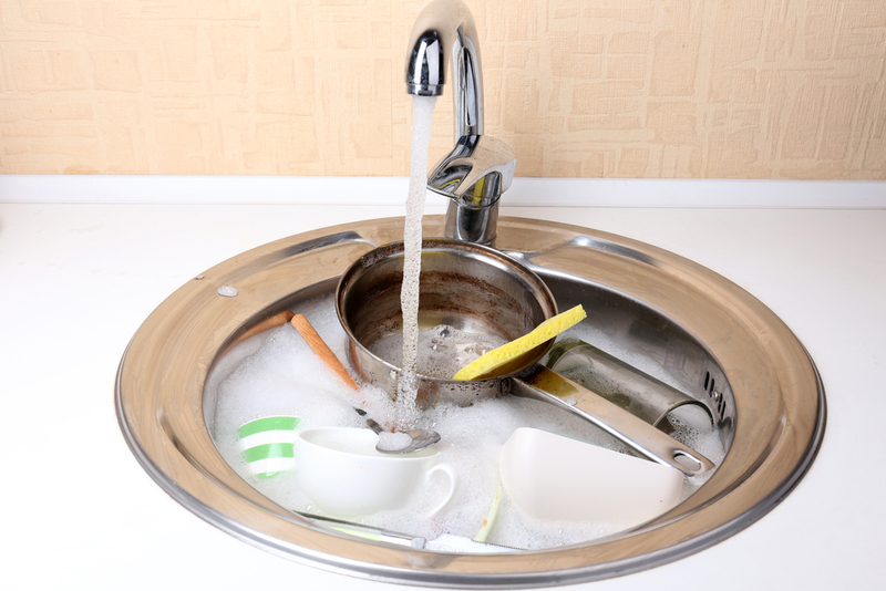Letting the Dishes Soak Too Long | Shutterstock
