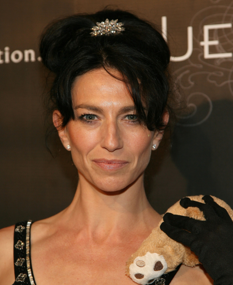 Claudia Black Then | Getty Images Photo by Maury Phillips