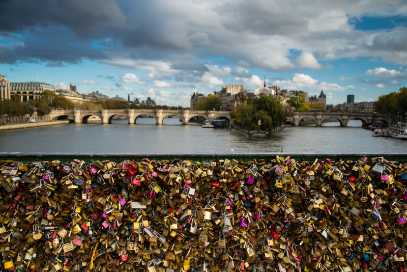 You leave padlocks on the Seine River bridge | Shutterstock Photo by marcin jucha