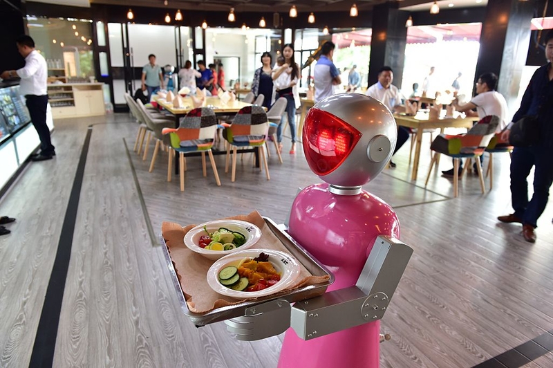 Robot Waiters in Yiwu, China | Getty Images Photo by VCG