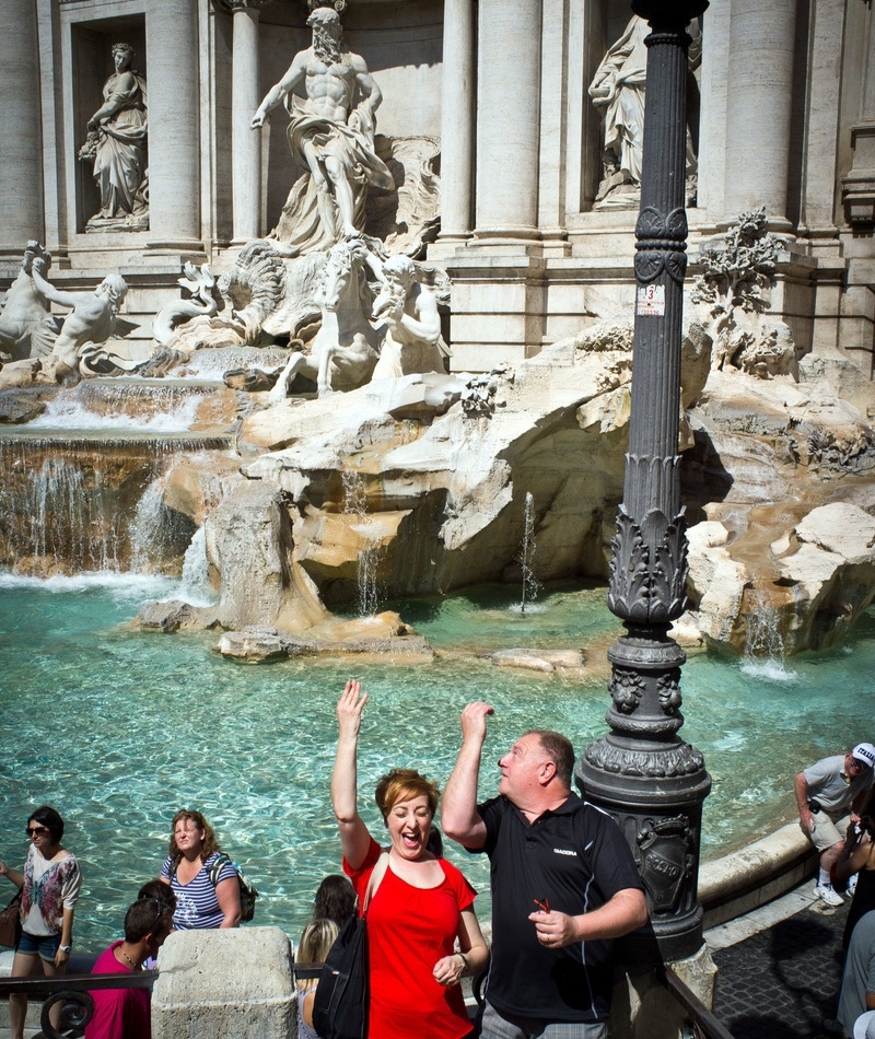 Tossing a Coin Into Trevi Fountain | Alamy Stock Photo